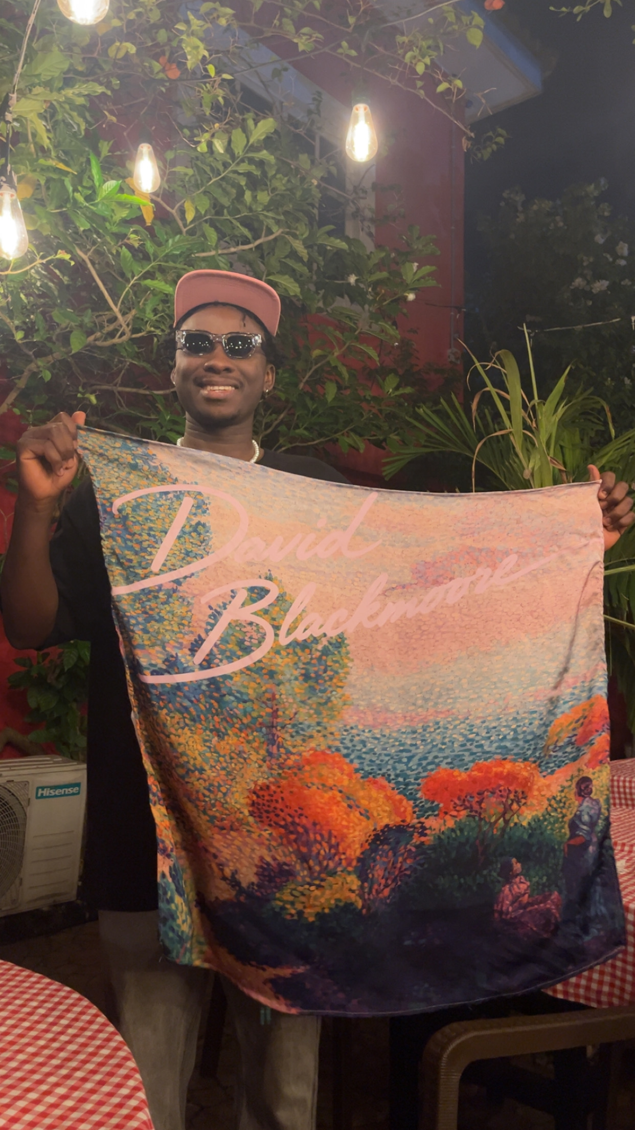 Prince holding a David Blackmoore art scarf